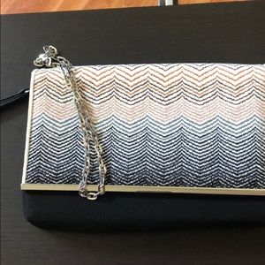 Clutch with silver chain strap